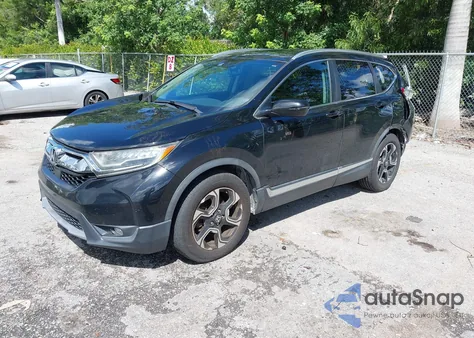 2018 Honda Cr-V Touring z USA, uszkodzony, nr VIN 7FARW1H96JE007525